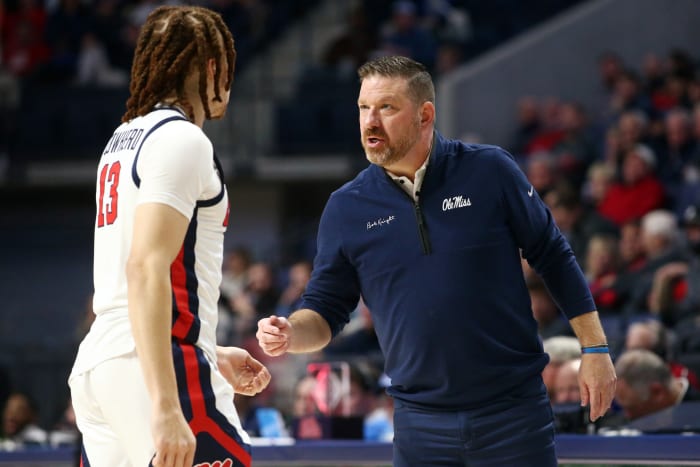 Ole Miss Rebels coach Chris Beard talking with forward Robert Cowherd (#13) versus the N.C. State Wolfpack (2023).